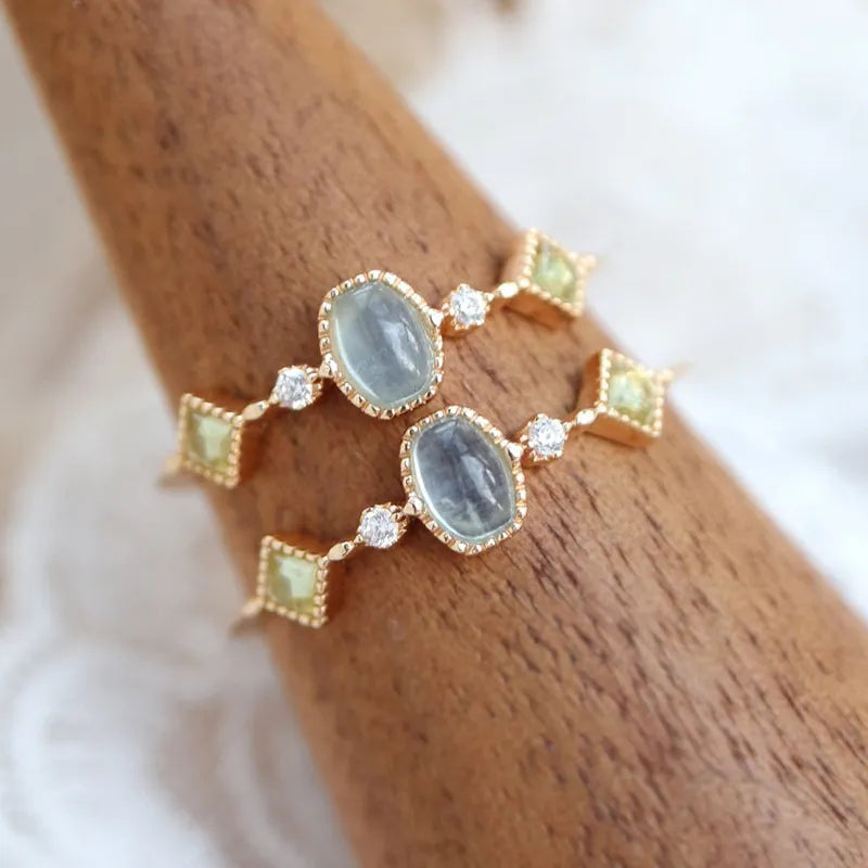 Anillo Aguamarina y Peridoto "Claridad" Plata Dorada