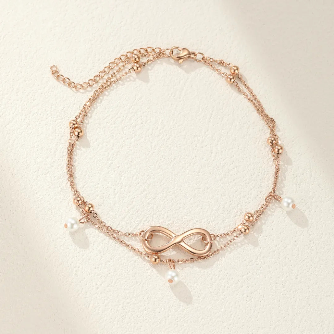 Bracelet de cheville double chaîne plaqué or rose avec pendentif infini et perles blanches